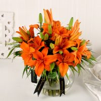blissful-orange-lilies-in-fishbowl-vase_1.jpg