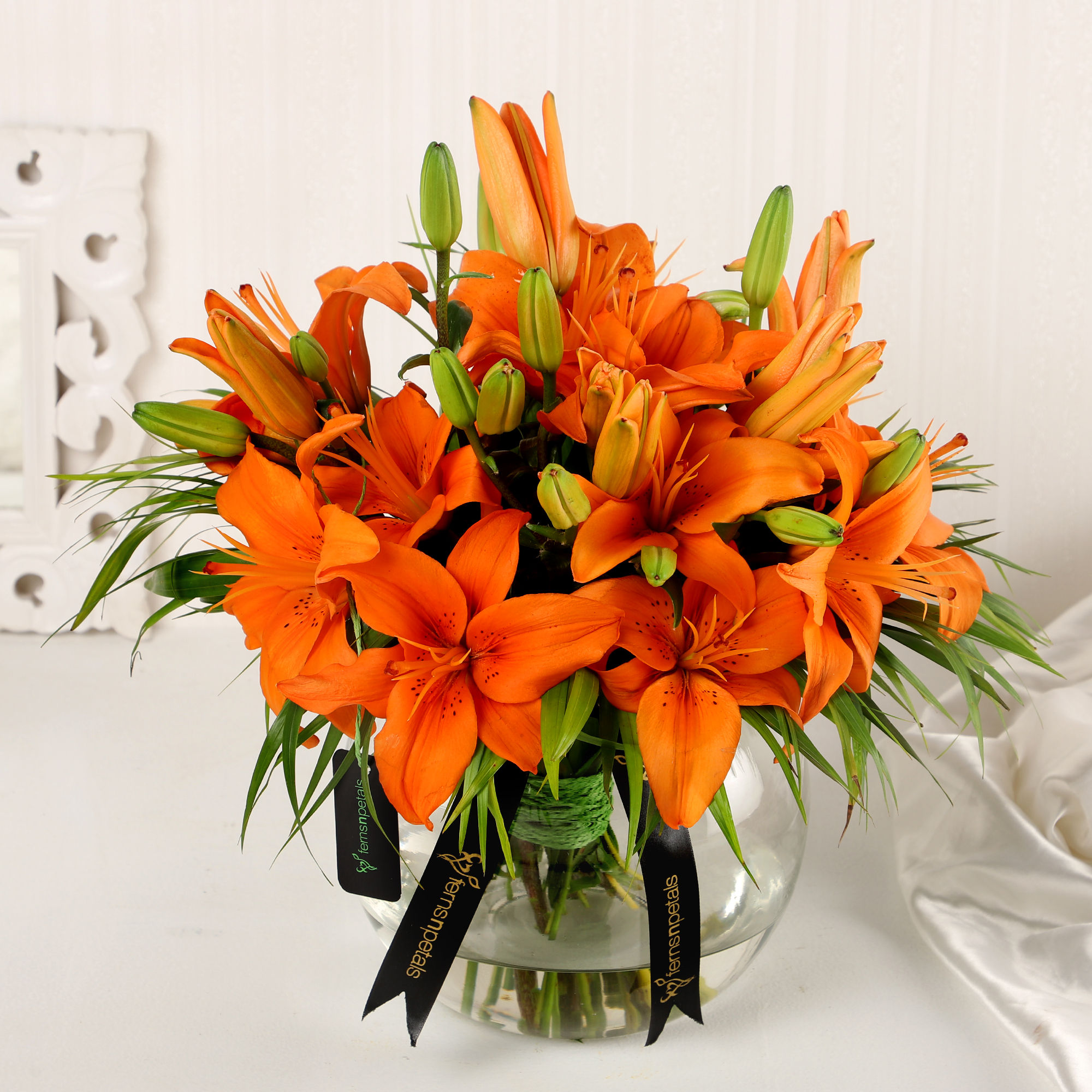 blissful-orange-lilies-in-fishbowl-vase_1.jpg