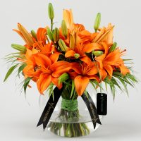 blissful-orange-lilies-in-fishbowl-vase_4.jpg